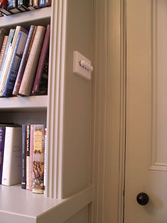 light switch built in to bookcase side