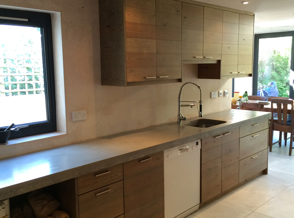 concrete and weathered wood kitchen by Peter Henderson Furniture