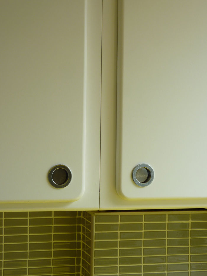 inset chrome handles in radiused surface mount 1950's style kitchen door