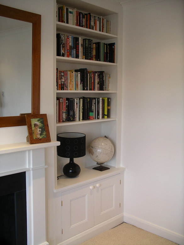 fiitted alcove bookcase with cabinet