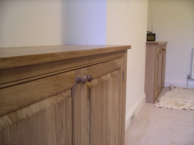 bespoke alcove cabinets in solid dark oak