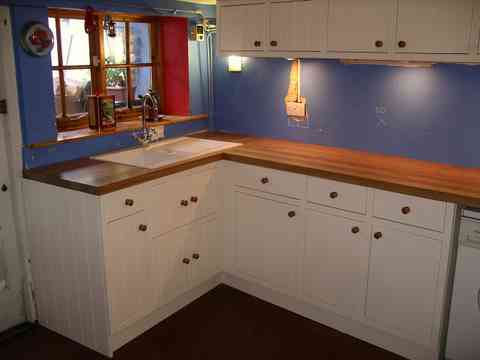 bespoke painted fitted kitchen with full framed tongue and groove doors