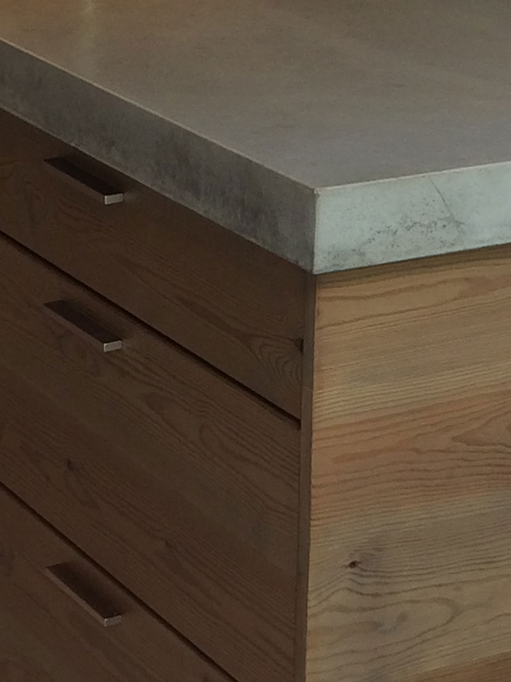 concrete and aged wood bespoke kitchen